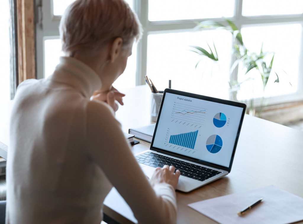 A user looking at a dashboard on a laptop